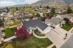 Aerial perspective of suburban area with a mountainous background
