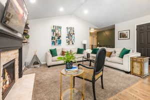 Living area featuring a brick fireplace