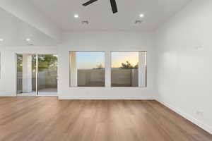 Empty room featuring recessed lighting, wood finished floors, and ceiling fan