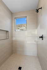 Bathroom with tiled shower