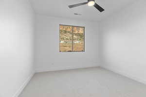 Unfurnished room with light carpet and a ceiling fan