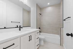 Full bath featuring vanity, shower / tub combination, and recessed lighting