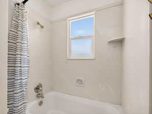 Bathroom with shower / bath combo with shower curtain