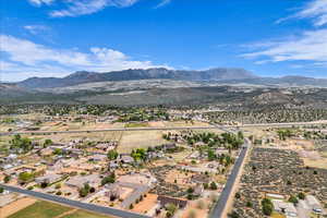 Aerial perspective of suburban area featuring a mountainous background