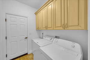 Laundry room with washing machine and clothes dryer and cabinet space
