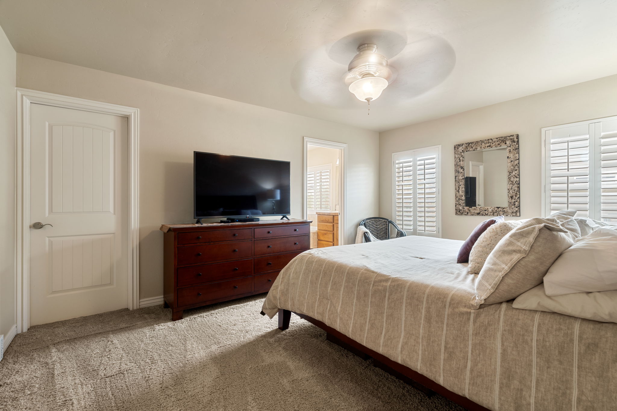 Bedroom featuring carpet floors and ceiling fan