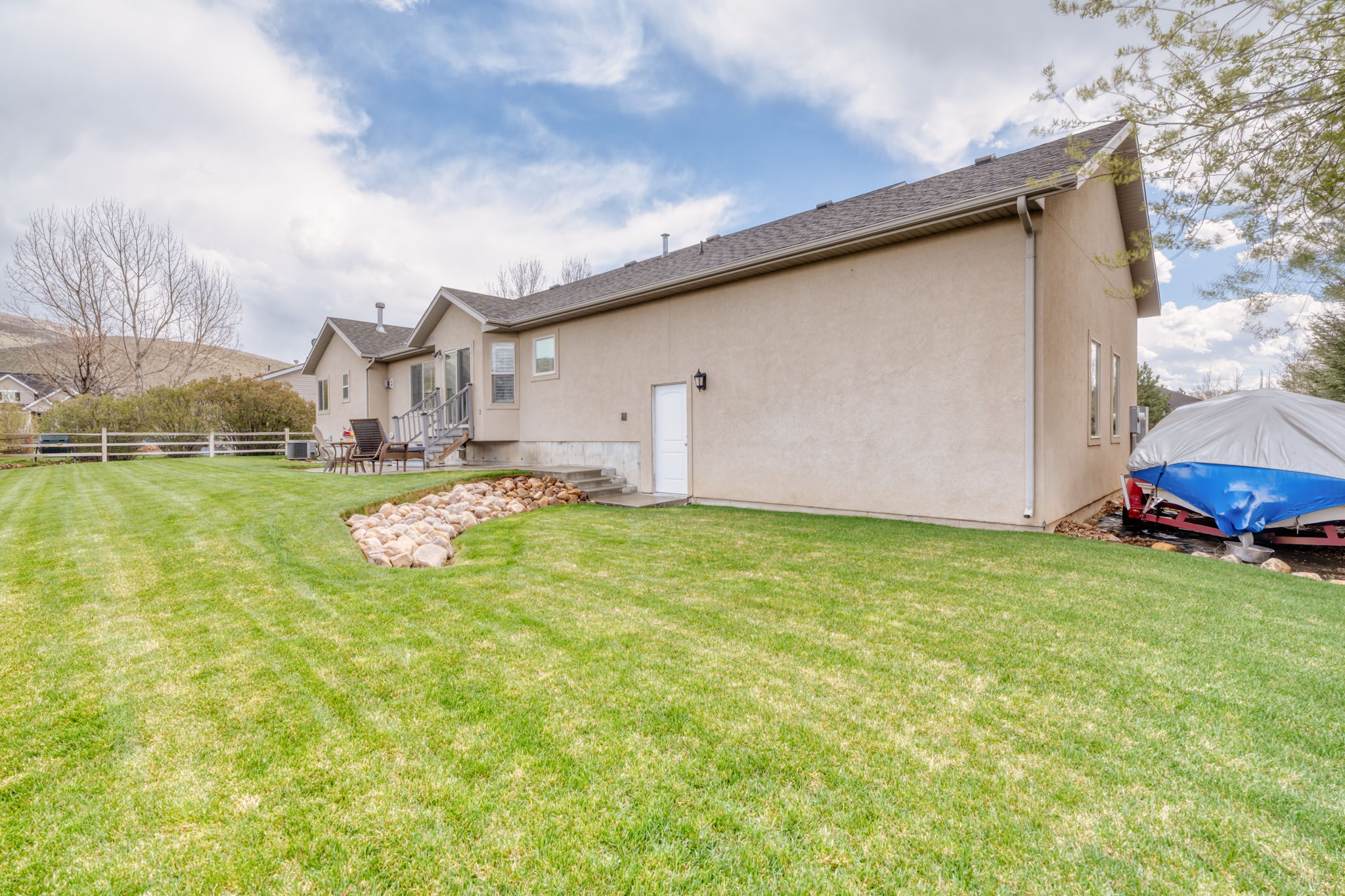 Back of property featuring stucco siding