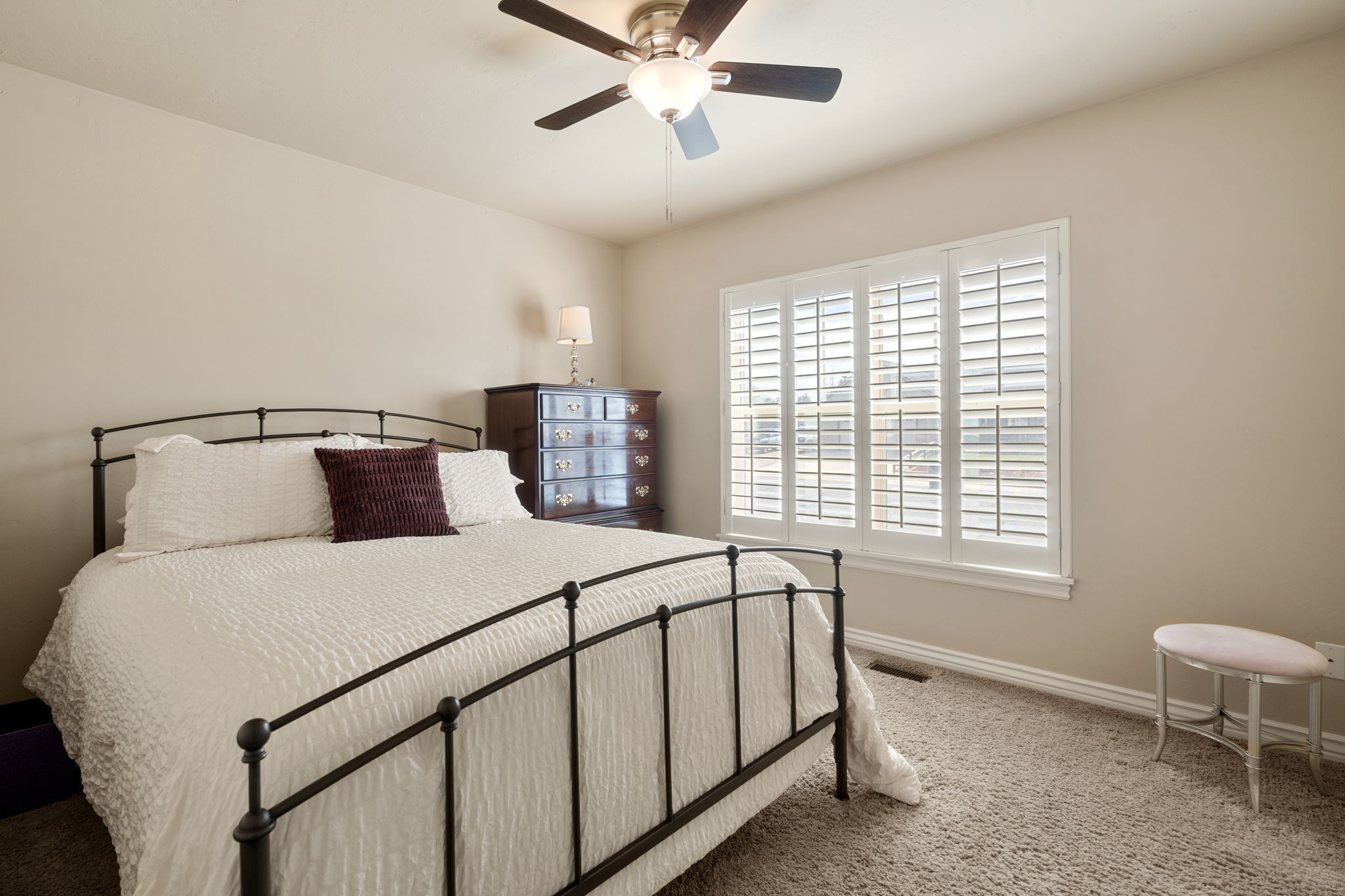 Bedroom featuring carpet and a ceiling fan
