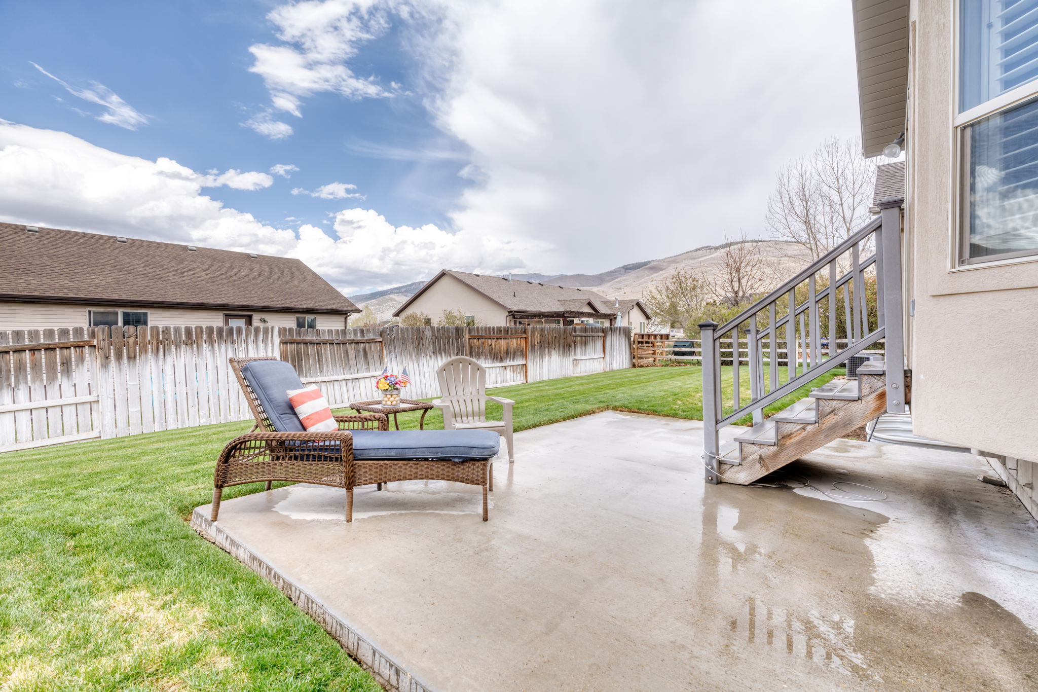 Fenced backyard with a patio area and a mountain view