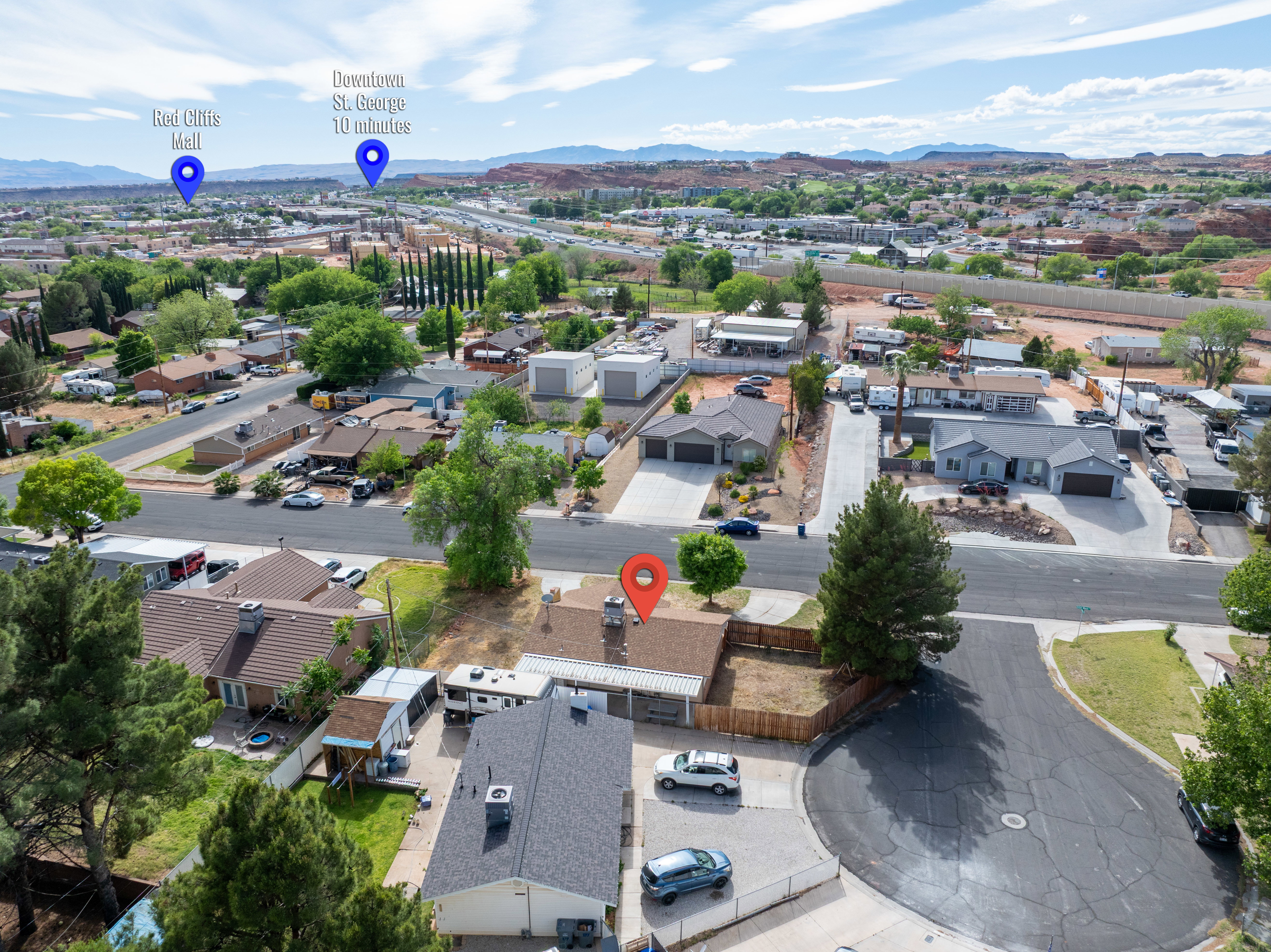 Aerial perspective of suburban area with a mountain backdrop