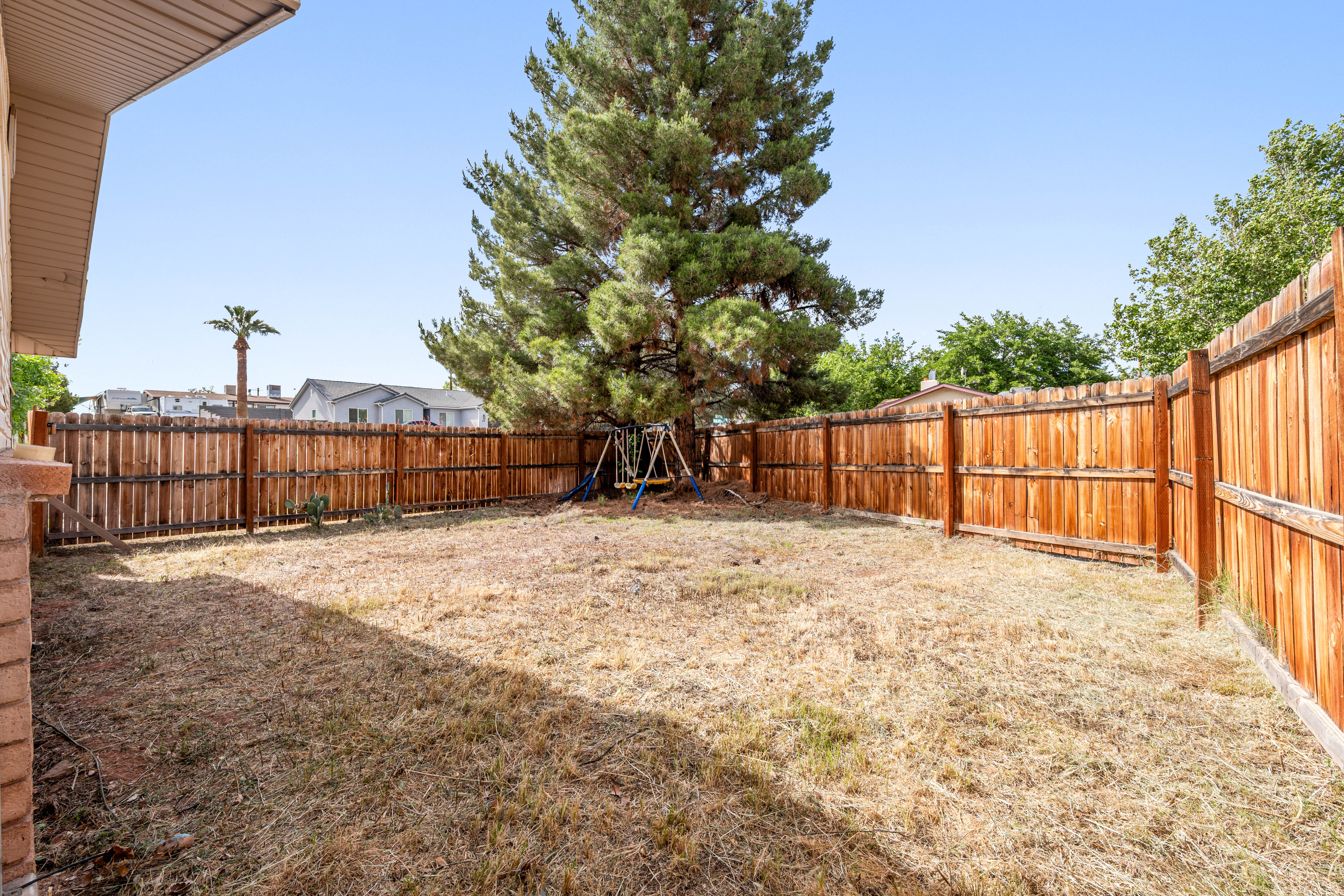 View of fenced backyard