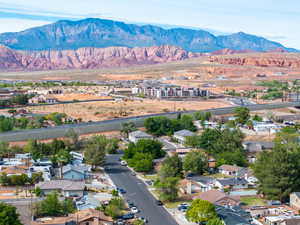 Aerial view of residential area featuring a mountainous background