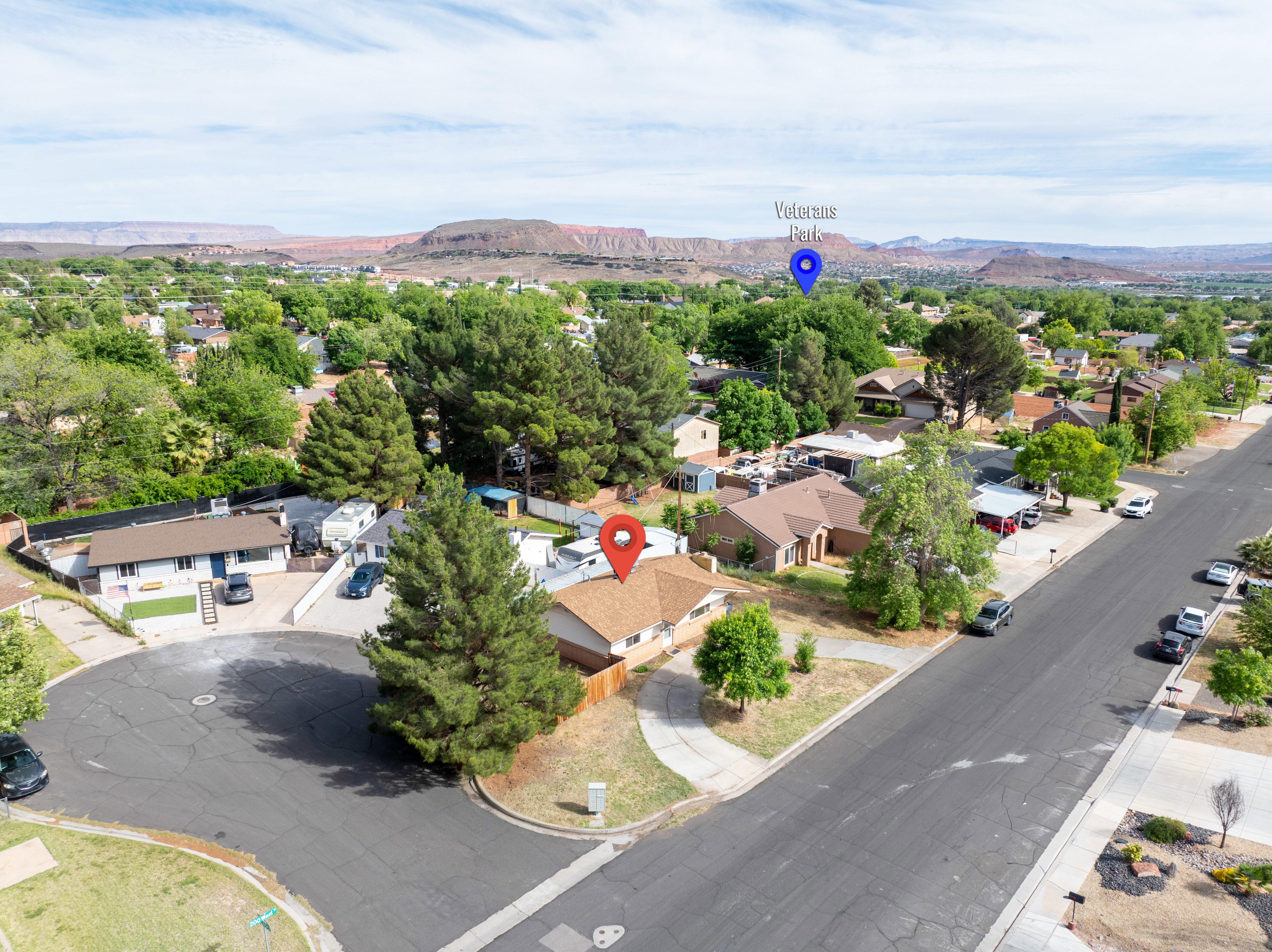 Aerial perspective of suburban area featuring a mountain backdrop