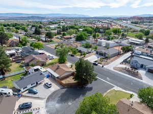 Aerial perspective of suburban area featuring a mountainous background
