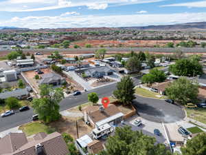 Aerial view of residential area featuring a mountainous background