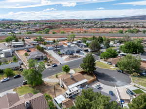 Aerial view of residential area featuring a mountainous background