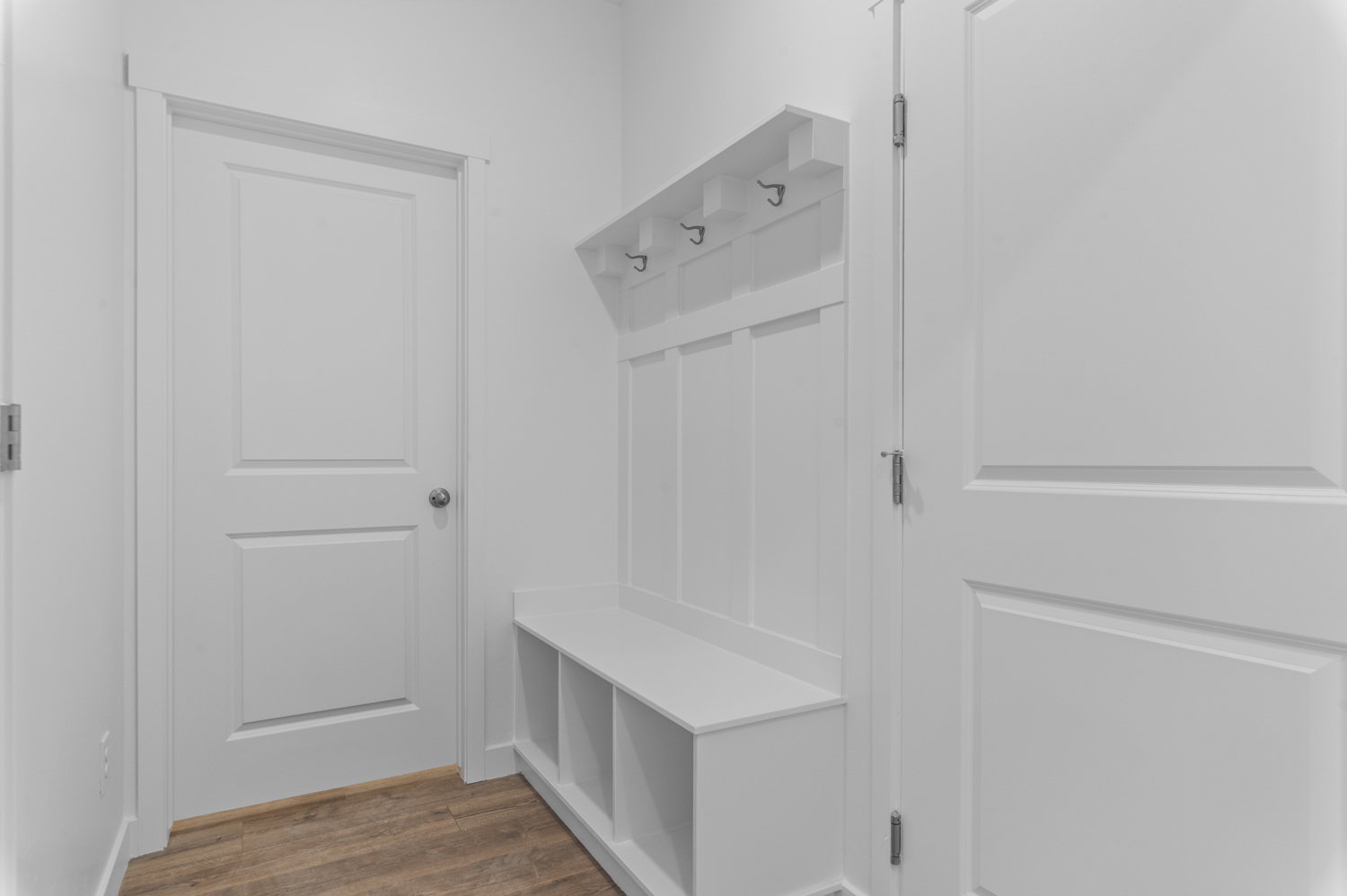 Mudroom featuring dark wood-style floors