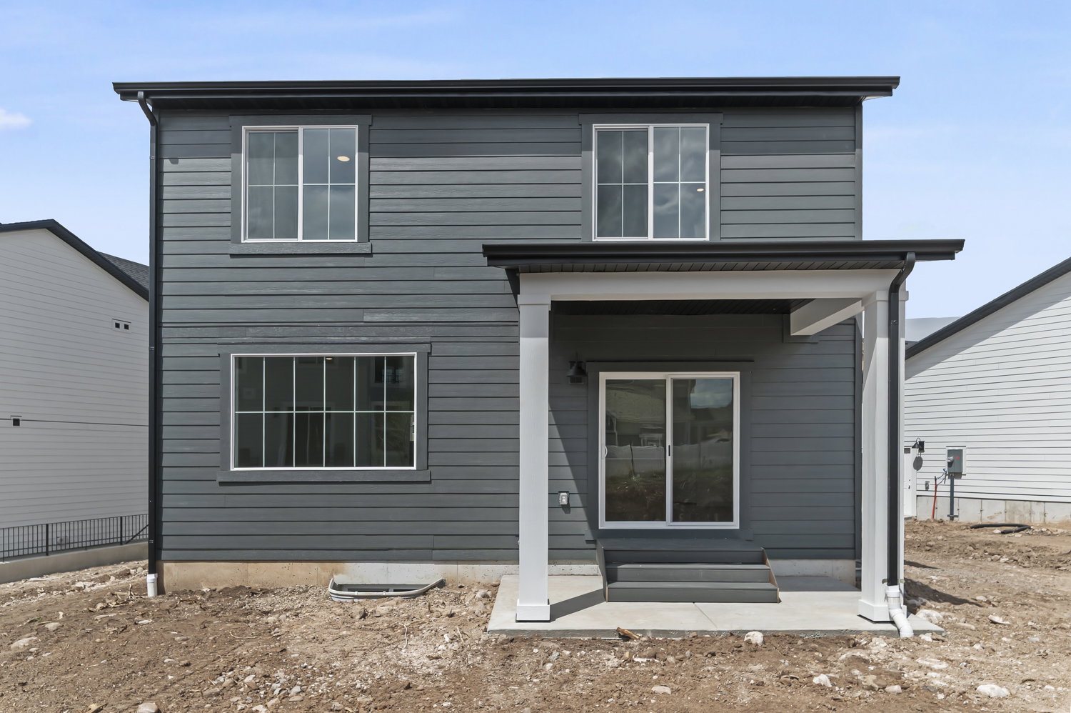 Rear view of house featuring entry steps