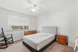 Bedroom featuring carpet floors and ceiling fan