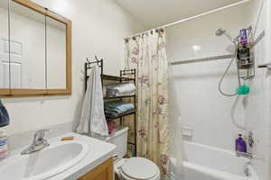 Full bathroom featuring vanity and shower / tub combo with curtain