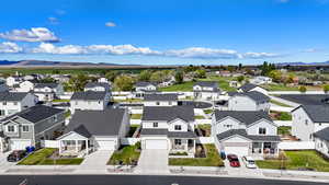 Aerial view of residential area featuring a mountainous background
