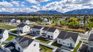 Aerial perspective of suburban area with a mountainous background