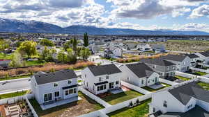Aerial view of residential area featuring mountains