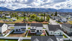 Aerial view of residential area featuring a mountainous background