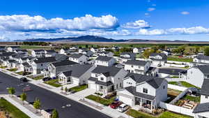 Aerial perspective of suburban area featuring a mountainous background