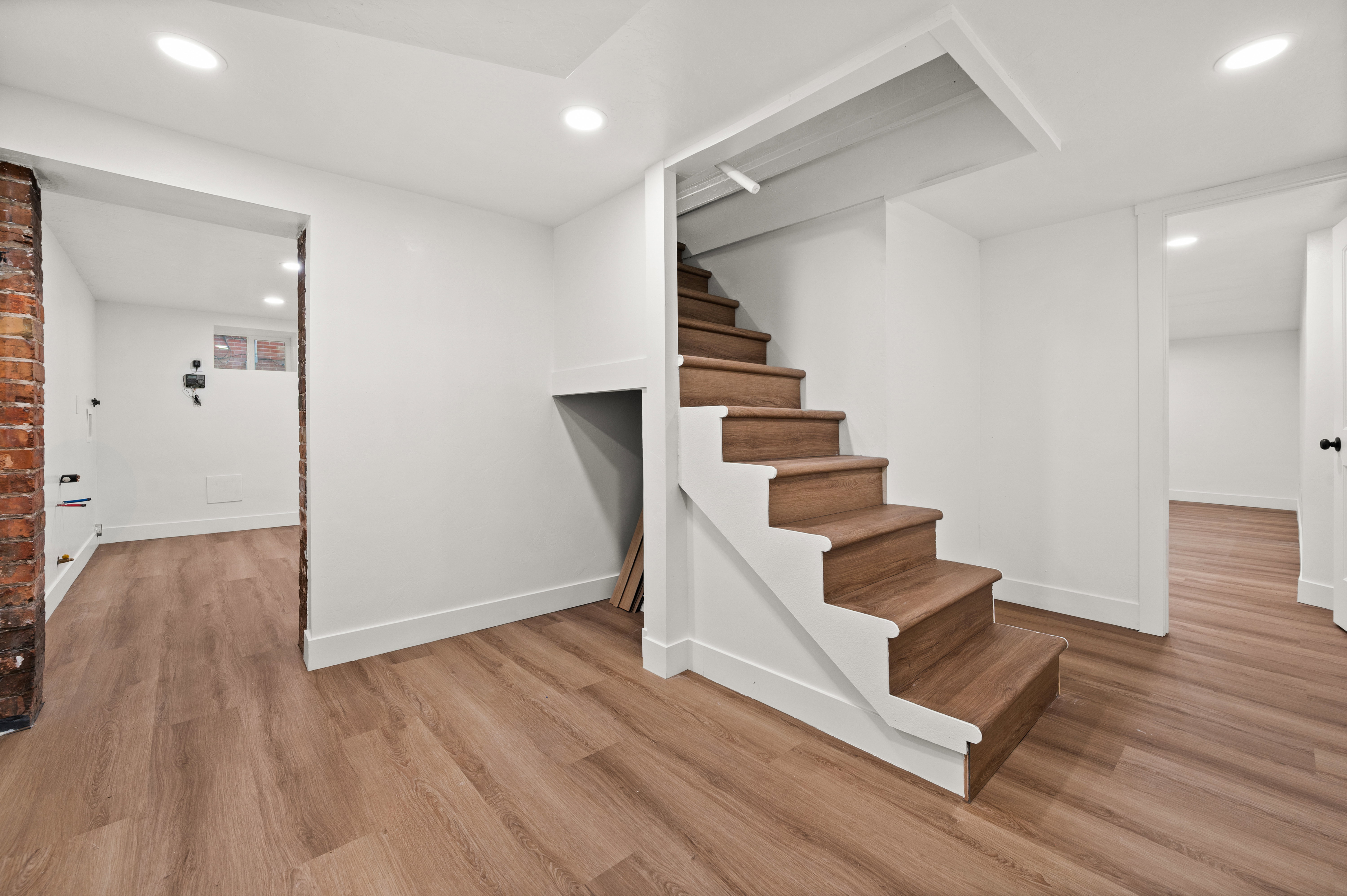Staircase featuring recessed lighting and wood finished floors