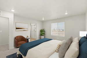 Bedroom featuring light colored carpet and recessed lighting