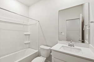 Full bath featuring vanity and shower / washtub combination