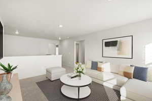 Living room with light carpet and recessed lighting