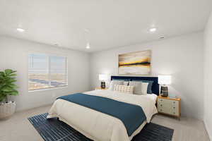 Bedroom with light colored carpet and baseboards