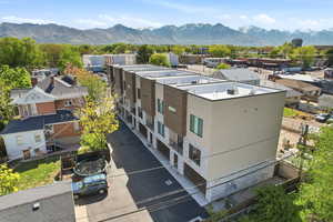 Aerial view of residential area featuring a mountainous background