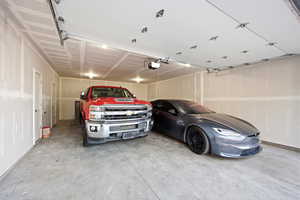 Garage featuring a garage door opener