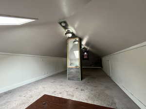 Additional living space featuring carpet floors and baseboards