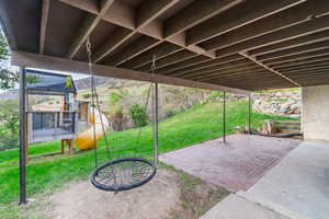 View of patio featuring a playground