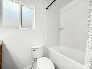 Full bathroom with vanity and shower / bath combo