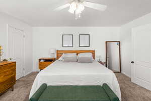 Bedroom with carpet and ceiling fan