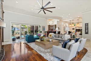 Great room with retractable doors open to spectacular outdoor setting