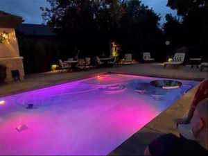 Pool beautifully illuminated for evening enjoyment