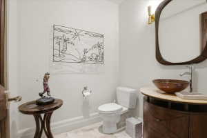 Half bath with vanity and light tile patterned floors