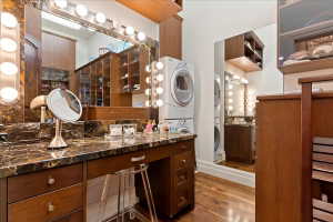 One of two closets features a vanity and washer/dryer