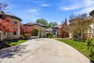 Front exterior featuring an arched porte-cochere