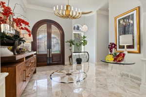 Elegant entry featuring double arched double doors