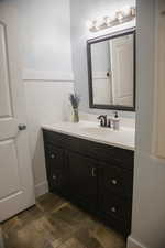 Main Floor Bathroom with wainscoting and vanity