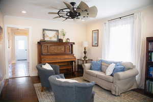 Living area featuring ceiling fan, wood-type flooring, crown molding, and recessed lighting