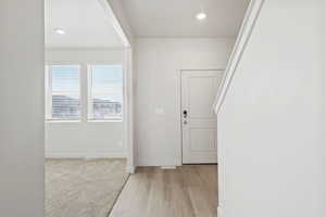 *DISCLAIMER*  Interior package and colors may vary. Entryway featuring recessed lighting and light wood-style flooring