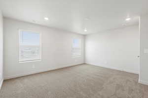 *DISCLAIMER*  Interior package and colors may vary. Empty room with light carpet and recessed lighting